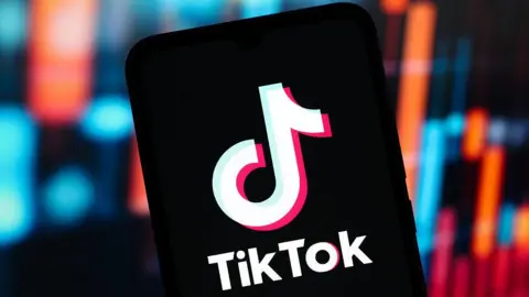 TikTok to lay off hundreds of UK content moderators Getty Images TikTok logo on a phone
