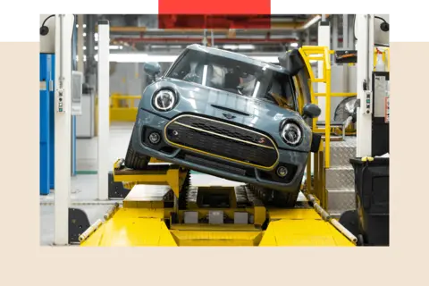 The UK car industry is at a crunch point Bloomberg via Getty Images A Mini Cooper S car on the production line at a sideways angle