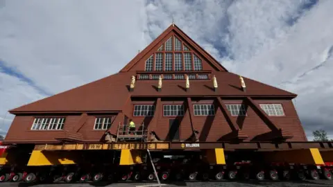 Entire church begins two-day journey across Swedish city of Kiruna Reuters Kiruna's historic wooden church sits on a wheeled transportation unit before being moved to a new site in Kiruna, Sweden