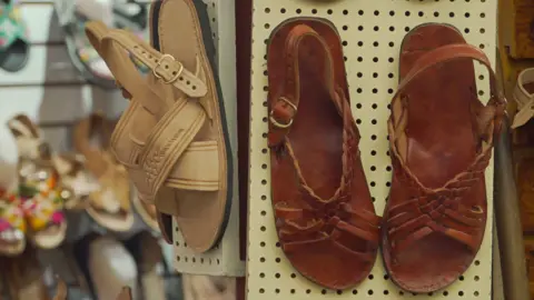 Willy Chavarria sorry after Adidas shoe cultural appropriation row Jesús Méndez/EPA/Shutterstock Traditional huaraches are displayed at a market in Oaxaca, Mexico