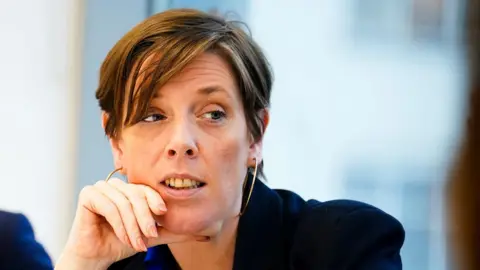 Tool used to assess domestic abuse risk doesn't work, Jess Phillips admits PA Media Jess Phillips looks on during a meeting as she wears a dark blue jacket. She has short, light brown hair and gold hooped earrings.
