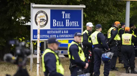 Man told girls in Epping he wanted to 'have a baby', court hears PA Media A group of police in hi-vis vests stand in front of a blue and white sign for The Bell Hotel in Epping.