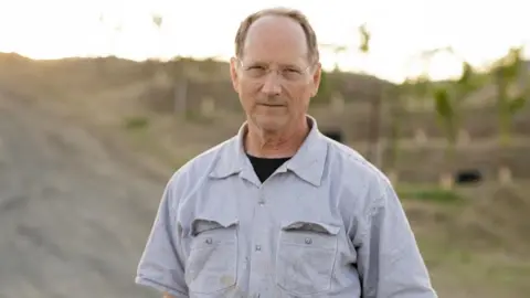 Climate change pushing winemakers to blend different years Meg Smith Winemaker Chris Howell standing in one of his vineyards in Napa Valley, California