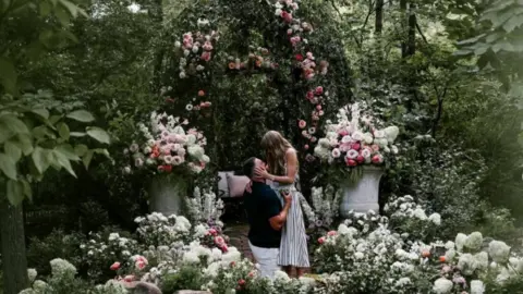 Tayvis are engaged - what we learned, and how fans reacted @TaylorSwift/Instragram Travis Kelce gets on one knee to pop the question to Taylor Swift surrounded by an abundance of flowers.