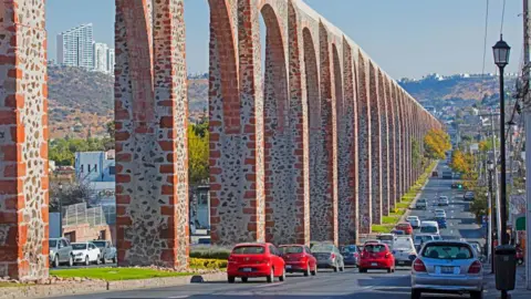 AI demand means data centres are worsening drought in Mexico Arterra/Getty Images The stone arches of Querétaro's aqueduct run into the distance next to a road