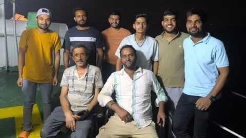 Why India tops the list of abandoned sailors The crew member of Stratos, with two of them sitting in the front and rest six standing behind, seen smiling for photograph after their ship refloated.