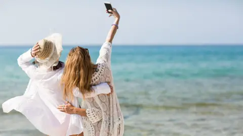Anger and confusion as Meta overturns more Instagram account bans Getty Images Two women taking a selfie