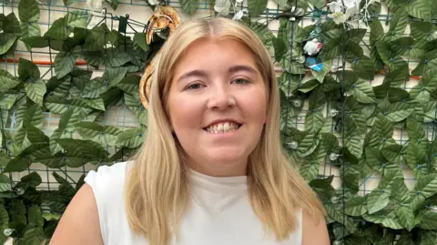 University students like me are happier living at home BBC A girl in a white top smiling at the camera