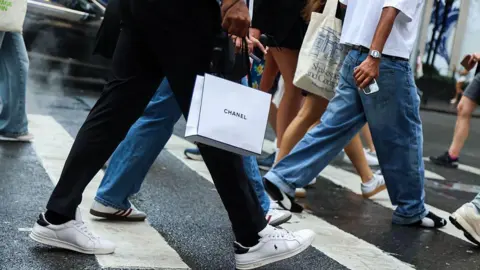 Why the US is expected to cut interest rates Bloomberg/Getty A shopper carries a Chanel store bag in New York, US, on Saturday, Sept. 6, 2025.