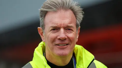 Rosyth shipyard expected to win £1bn Danish navy contract Getty Images A man with short grey hair smiles at the camera. He wears a fluorescent yellow jacket