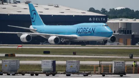 South Korea workers detained in US raid head home AFP A Korean Air Boeing 747-8I from Seoul, to repatriate hundreds of South Korean workers who were detained in an immigration raid at a Hyundai-LG battery plant under construction in the US state of Georgia last week, is seen in the cargo area of Hartsfield-Jackson Atlanta International Airport in Atlanta, Georgia, on 10 September, 2025.