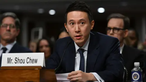 Trump's deal may be close but what's in it for China? Getty Images TikTok CEO Shou Zi Chew speaks during a Senate hearing