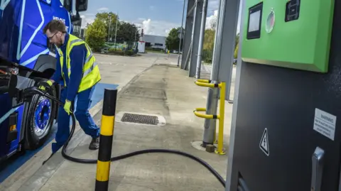 Lack of charging facilities a 'barrier' for electric lorries Lorry driver Liam Ely charging his cab
