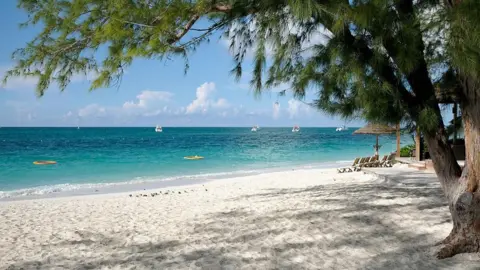 The Caribbean islands battling the region's 'highest murder rate' Getty Images A beach on Providenciales island, which is the most populated in Turks and Caicos