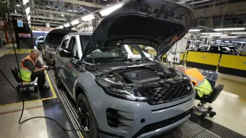 Labour must step up to help JLR supply chain jobs, says Unite Reuters Staff members assemble Range Rover Evoque SUVs on the production line at Jaguar Land Rover's Halewood factory in Liverpool