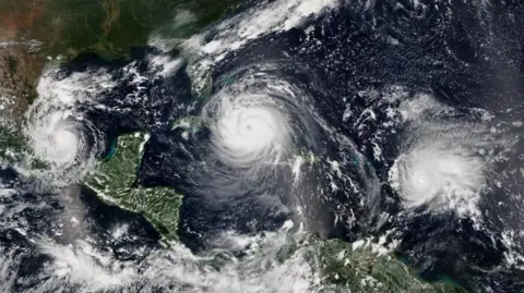 The Caribbean island making millions from the AI boom Getty Images A satellite image of three hurricanes hitting the Caribbean at the same time in September 2017. From left to right - Katia, Irma, and Jose