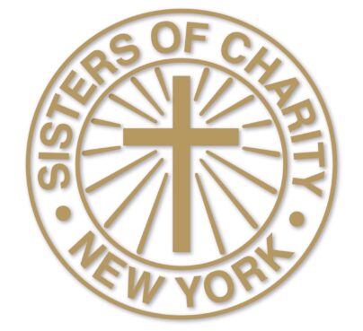 gold cross NY Catholic sisters condemn Cardinal Dolan's praise for Charlie Kirk