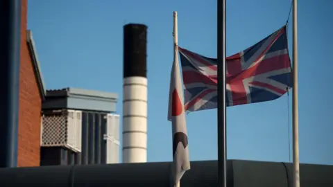 MoJ owes us £20m after contractor ISG's collapse, say suppliers Getty Images A prison with a union flag flying high. We can see some of the blocks behind. It is a clear and sunny day. The sky is blue.
