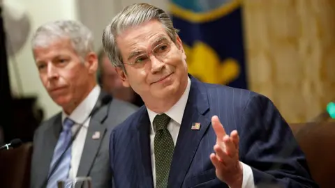 The US bet big on Argentina bailout Getty Images US Treasury Secretary Scott Bessent, in a blue pinstripe suit with American flag on his lapel, raises his eyebrows and holds out his hand as he speaks during a meeting at the White House on October 14, 2025 in Washington, DC