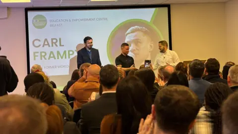 Children from Belfast low income families to be given free tuition Paul Doherty, Carl Frampton and Ciaran Toman are seen speaking in front of a crowd at the opening of the new centre
