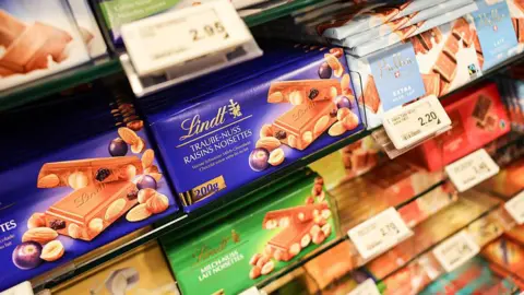 Swiss companies target alternative export markets Getty Images Bars of Swiss chocolate on a shop shelf.