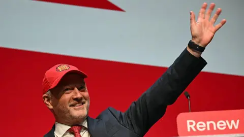 Reed says 'job on the line' over 1.5m housing target as experts warn meeting it unlikely Getty Images A smiling Steve Reed in suit and tie waves, wearing a red baseball cap embroidered with the words "Build Baby Build!"