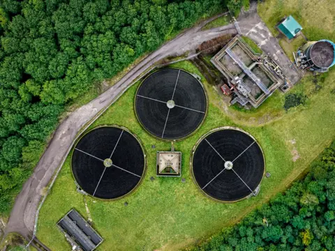 Fining firms for sewage spills will get 'quicker and easier', says government Getty Images An aerial view of a sewage treatment plant.