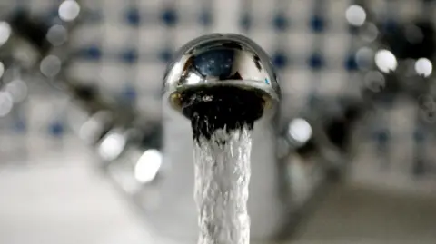 Water companies told to refund £260m to customers. PA Media A bathroom tap with flowing water