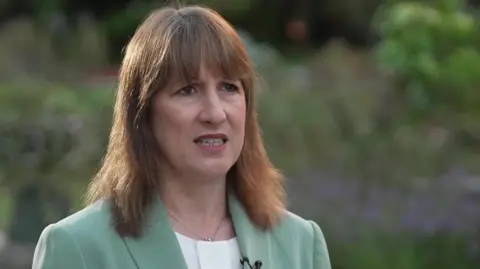 Rachel Reeves plans 'targeted action' on bills in Budget BBC Rachel Reeves wearing a light green jacket over a white top