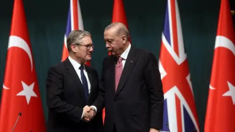 Starmer signs £8bn deal to supply Turkey with Typhoon fighter jets EPA Sir Keir Starmer and Turkish President Recep Tayyip Erdogan shake hands in front of the UK and Turkish flags