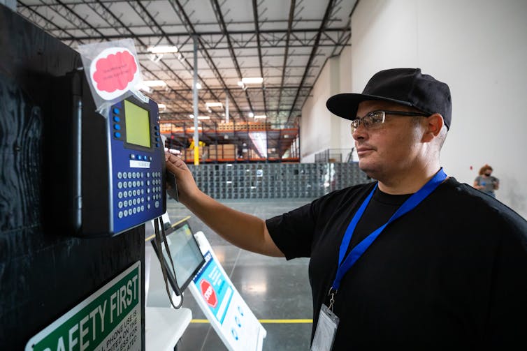 An Indigenous approach shows how changing the clocks for daylight saving time runs counter to human nature – and nature itself A person swipes a card in a machine on a wall.