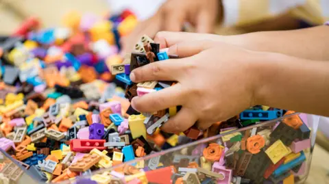 Daniel Knighton/Getty Images Children learn to assemble LEGO bricks during the Master Model Builder Show at LEGO Festival Media Day at LEGOLAND California on May 03, 2025 in Carlsbad, California