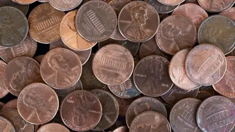 AFP via Getty Images A pile of copper-coloured pennies