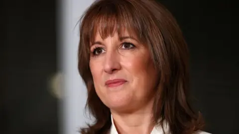 PA Media Rachel Reeves, who has brown shoulder-length hair, in a close-up shot 