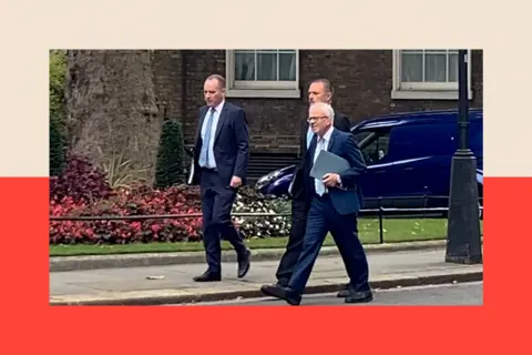 The difficult question about how powerful the Budget watchdog is Richard Hughes (left), Andy King and David Miles (right) walk along a street wearing suits