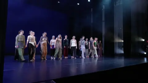 Students on a stage at Trinity Laban