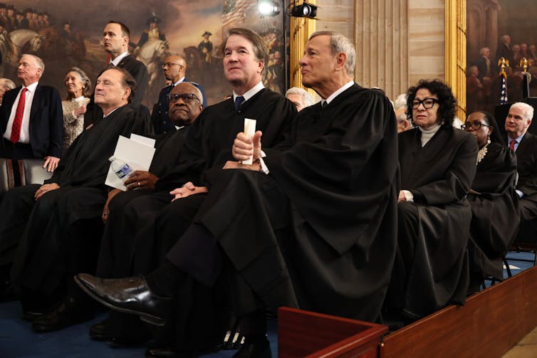 Supreme Court soon to hear a religious freedom case that’s united both sides of the church-state divide Several rows of seated men and women, many of whom are wearing long black robes.