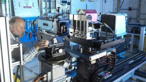 Diamond Light Source A technician adjusts equipment at Diamond Light Source
