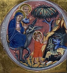 A small, colorful illustration with a gold background shows two adults and a child with halos, looking into a cave at small blue and green dragons