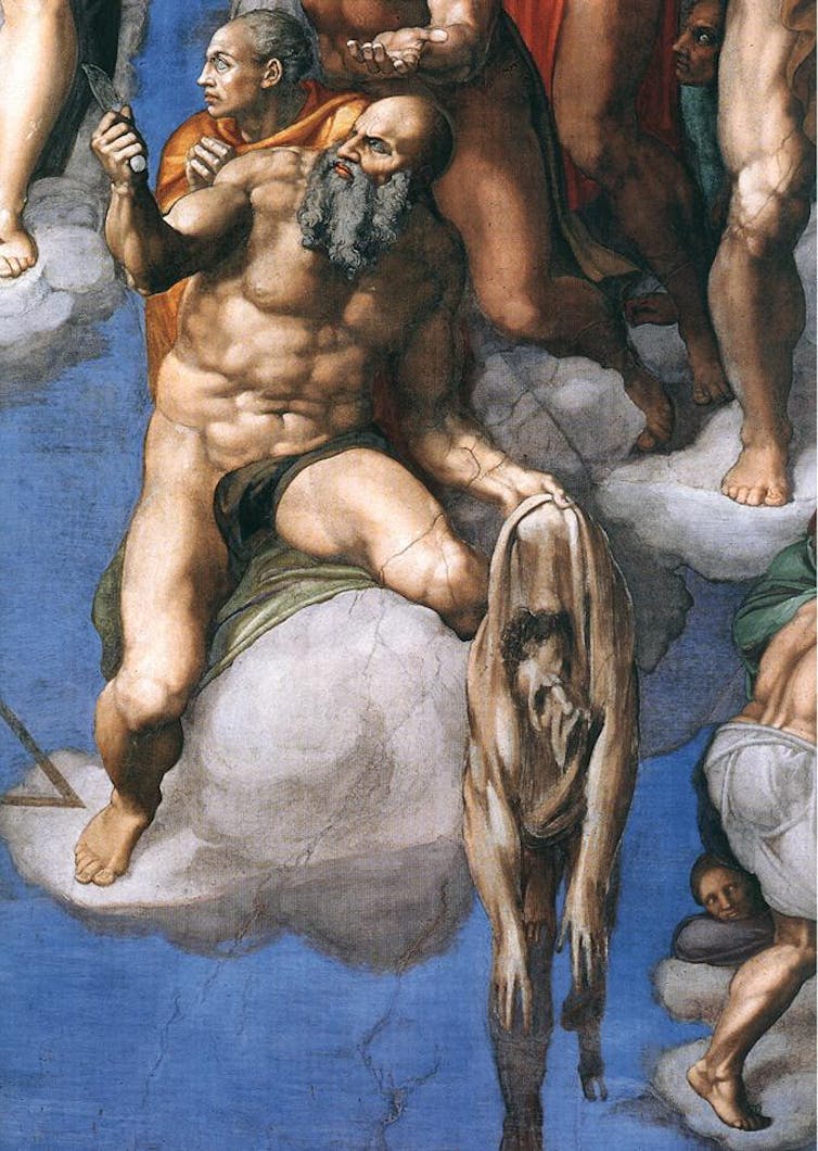 Why Michelangelo’s ‘Last Judgment’ endures A painted scene shows a bearded man holding a knife in one hand and a flayed skin with a human face in the other, while another figure sits just behind him.